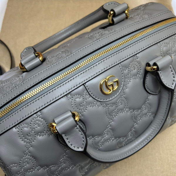 G*u*i gg matelassé leather top handle bag