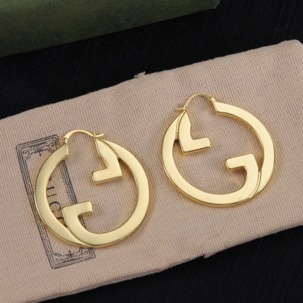 G*u*i earrings